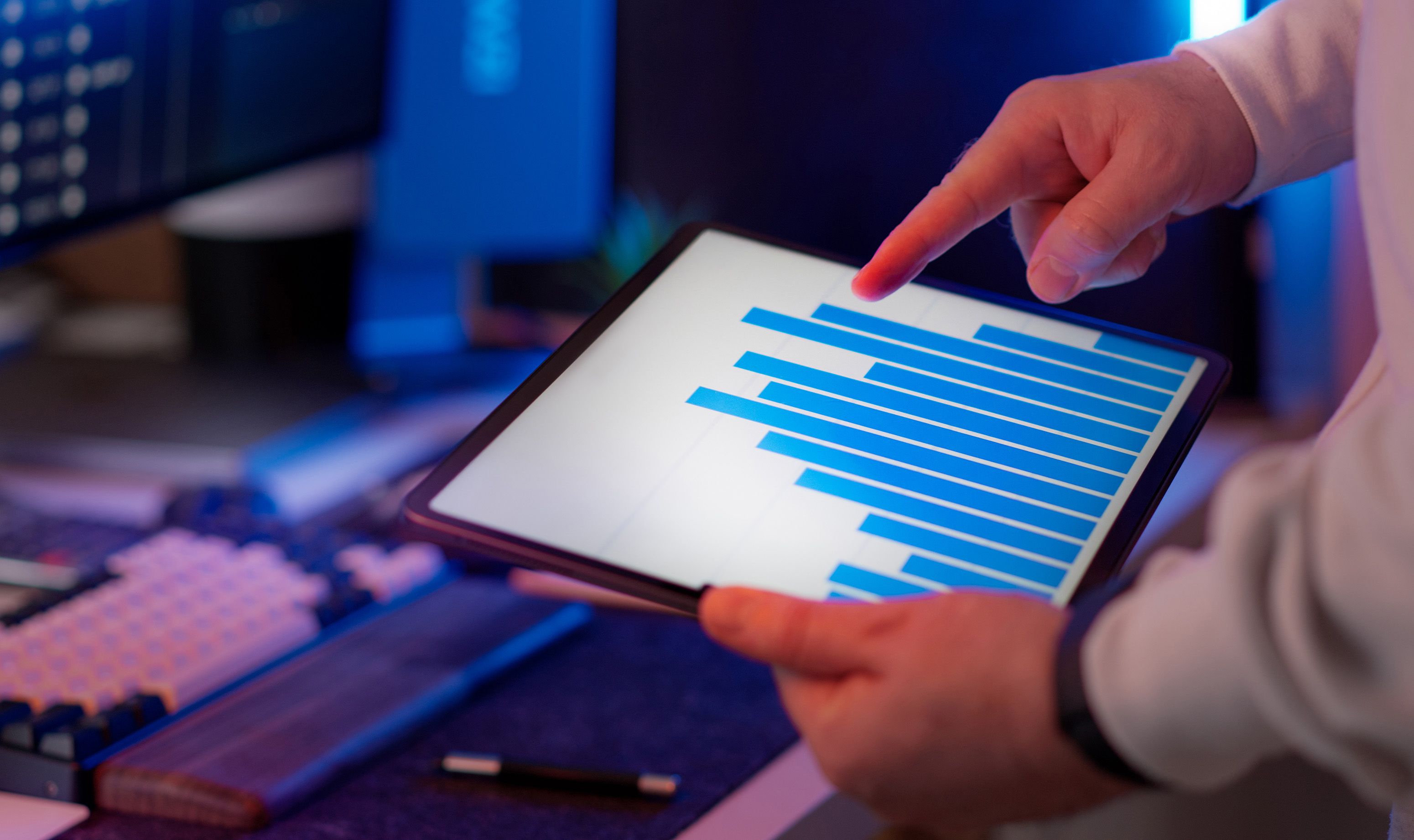 Close-up of a tablet used to review data in a technology workspace